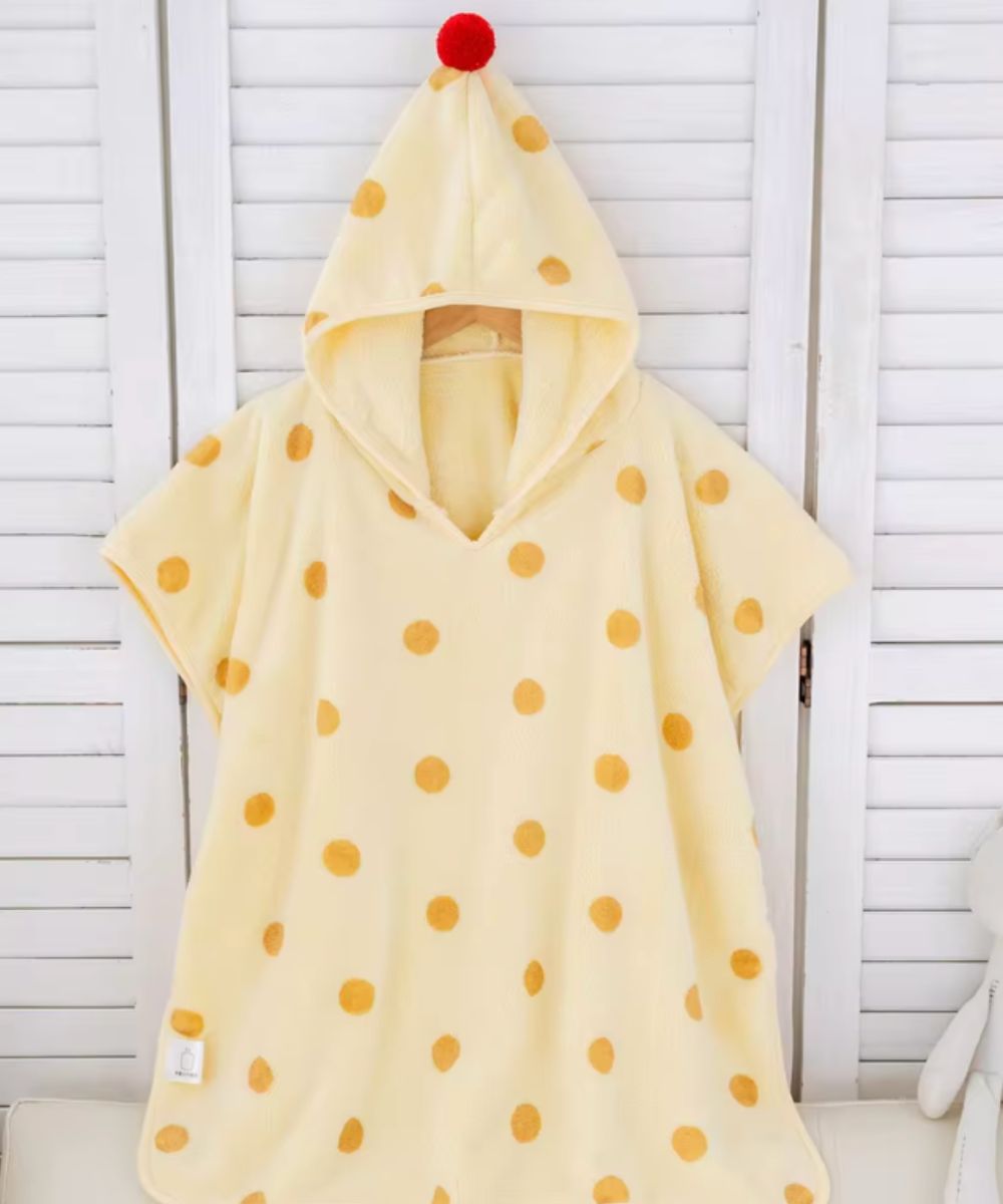 Poncho de bain bébé Planète Poncho jaune pâle à pois orange avec capuche et pompon rouge